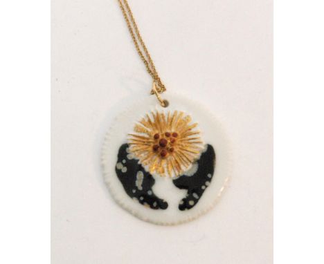 A Danish Royal Copenhagen and Anton Michelsen circular white ceramic pendant, 'Fireworks' designed by Nils Thorsson with gold
