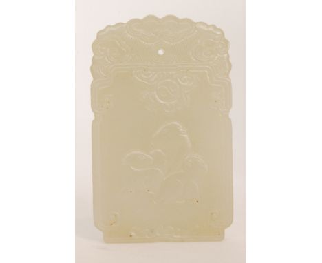 A Chinese celadon jade pendant,  finely carved in shallow relief with a three rats below a ying and yang symbol encircled by 