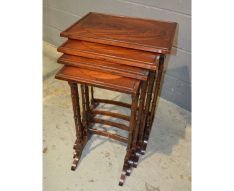 A quartetto nest of four mahogany line inlaid occasional tables, on ring turned legs and splayed feet, width of largest 50cm.
