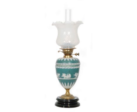A Victorian Jasperware slate blue brass oil lamp and shade decorated with Romanesque chariots and figures on a circular glaze