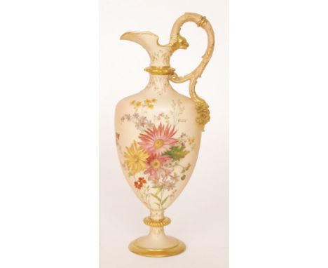 An early 20th Century Royal Worcester blush ivory shape 789 pedestal ewer decorated with flowers and foliage against the blus