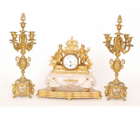 A 19th Century gilt metal clock garniture mounted with two figures and a pair of candelabras on white alabaster bases, height