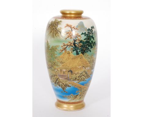 An early 20th Century Japanese Soko China Satsuma baluster vase panel decorated with a house before mountains and trees, the 