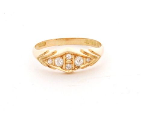 An early 20th Century 18ct hallmarked seven stone diamond boat shaped ring, ring size leading edge P, Chester 1914.
