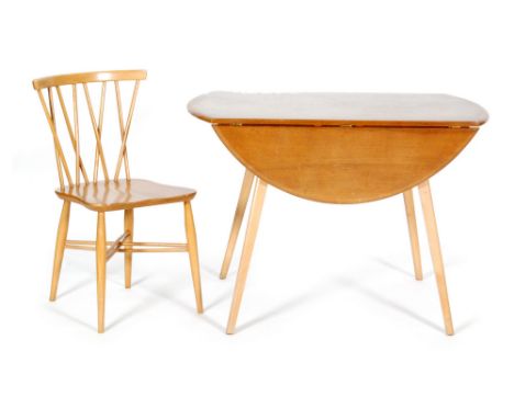 A set of four post war Ercol light elm and beech 'Candlestick' or 'Chiltern' dining chairs, together with an Ercol drop-leaf 