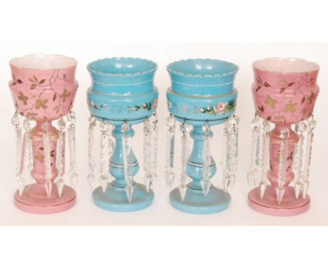 A pair of late 19th Century Continental glass table lustres, the domed foot rising to a baluster stem and flared bowl decorat