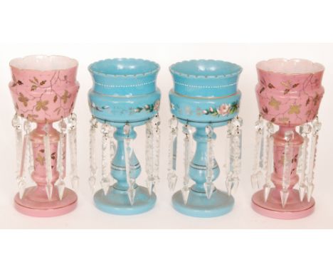 A pair of late 19th Century Continental glass table lustres, the domed foot rising to a baluster stem and flared bowl decorat