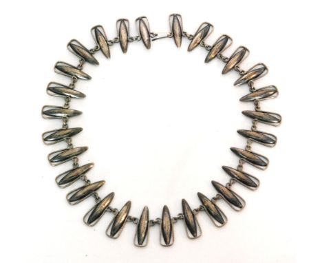 A 1960s Polish silver link necklace of industrial design, formed of navette shaped links each mounted within a textured silve