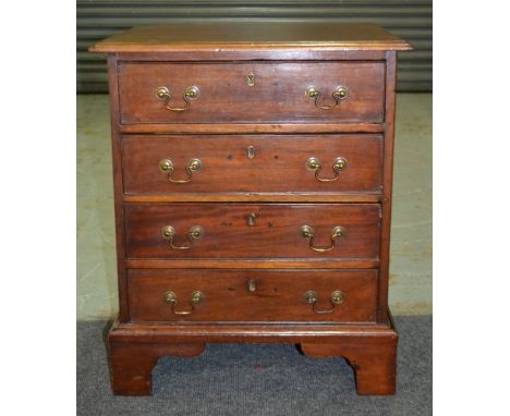 A small mahogany chest of four cockbeaded drawers in the Georgian style, with brass drop handles above bracket feet, height 6