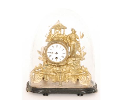 A small 19th French pressed gilt metal mantle clock and dome, height 26cm (2)