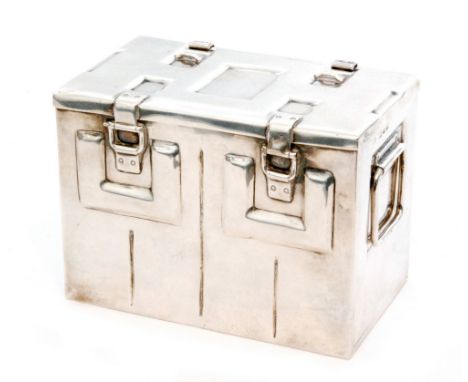 A hallmarked silver rectangular box modelled as a twin handled munitions trunk, the hinged cover opening to a green velvet li