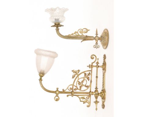 A small 20th Century brass wall oil lamp and bracket with fluted shade, width 32cm, and a similar leaf adjustable brass wall 