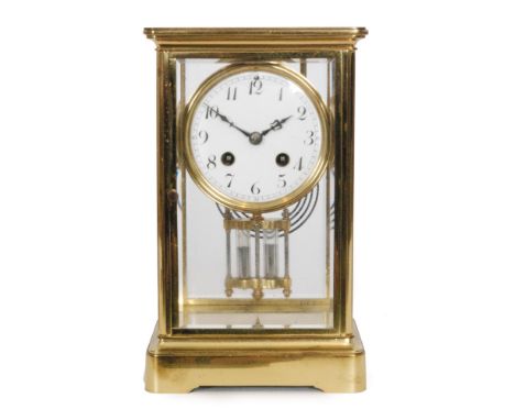 A 20th Century brass bevelled cased mantle clock with circular white enamelled dial and mercury suspended pendulum, height 25