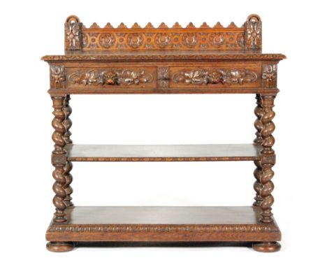 A late 19th to early 20th Century oak buffet, with a foliate carved shallow rail back above two frieze drawers with carved 'G