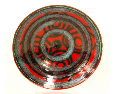 Two Poole Pottery Delphis shape 4 chargers, the first decorated by Angela Wyburgh with a mottled concentric circle design aga