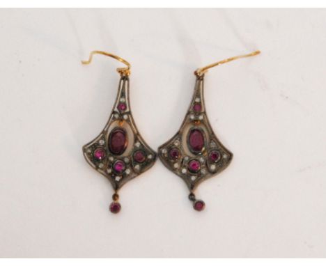 A pair of Edwardian style ruby and diamond pendant earrings, the pierced frame collar set with five mixed cut rubies, central