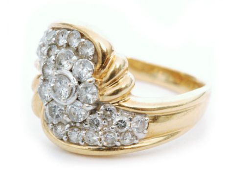 A modern 18ct hallmarked diamond cluster ring, central seven stone daisy cluster with spiraling diamond set, brilliant cut sh