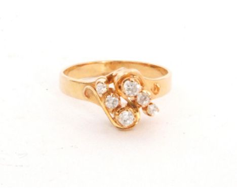 A South East Asian six stone diamond ring comprising two rows of three graduating claw set stones to a plain shank, ring size