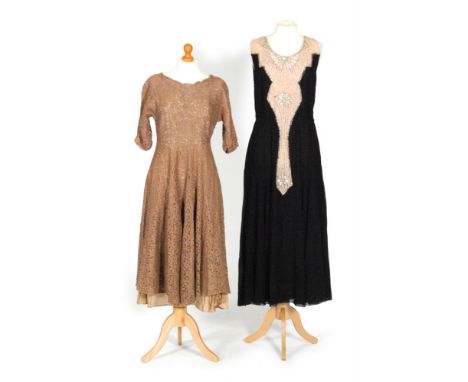 A 1930s ladies vintage drop waisted dress, the black chiffon with a peach central panel decorated with silver beads and diamo