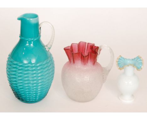 A late 19th Century Stourbridge Crackle glass jug of ovoid form with crimped neck in graduated clear to cranberry, together w