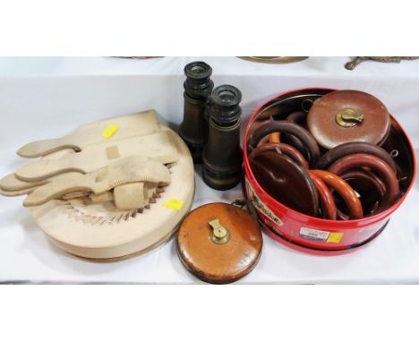 Vintage wooden curtain rings, leather bound tape measures, pair of binoculars, wooden butter pats and chopping blocks
