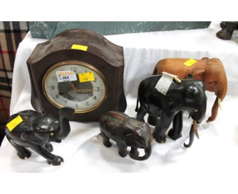 Smiths Enfield Bakelite mantel clock and four carved elephant figures