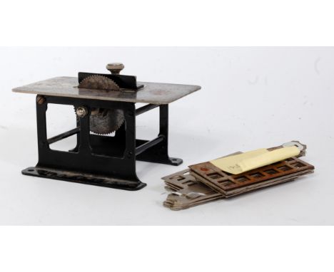 An original Meccano circa 1920s saw bench, appears complete, comprising of black base with stainless steel components, togeth