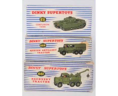 A Dinky Toys boxed military diecast group, three examples to include No. 661 recovery tractor, No. 651 Centurion tank, and No