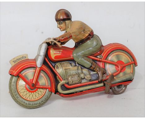 A Technofix (US zone of Germany) No. GE258 tinplate motorcycle and rider comprising of orange and cream tin printed body with