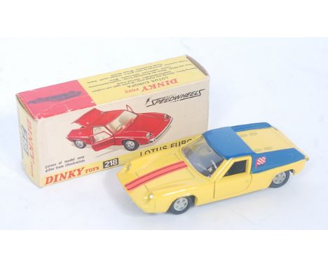 A Dinky Toys No. 218 Lotus Europa comprising of yellow and blue body with orange and black racing stripe and cast hubs, house