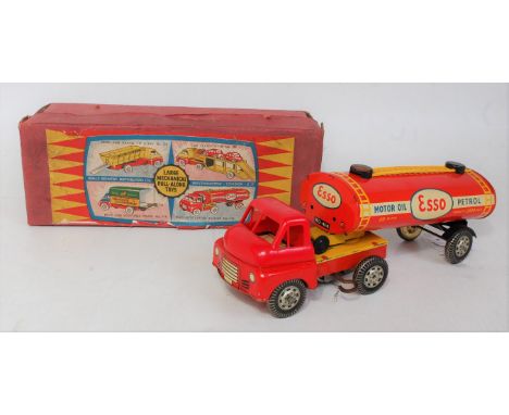 A Wells Brimtoy (UK) large articulated model of an Esso petrol tanker comprising of tinplate and plastic Bedford type cab wit