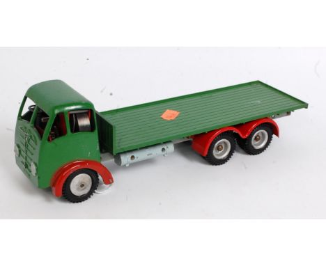 A Shackleton Models Foden FG clockwork ten wheel flatbed delivery truck, comprising of green cab and back with red mudguards 