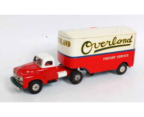 A Yamaichi of Japan tinplate and friction drive model of an Overland Freight Service articulated transport tractor unit and t