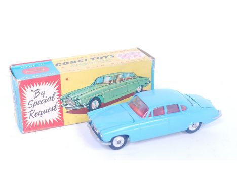 Corgi Toys, 238, Jaguar Mark X, light blue body with red interior, spun hubs, with luggage load, in the original blue and yel