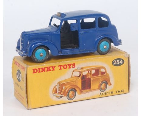 Dinky Toys, 254, Austin Taxi, comprising rare dark blue body with light blue hubs, in the original picture sided all card box