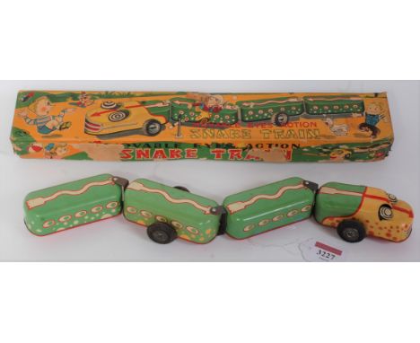 A TN Nomura tin plate and friction drive model of a snake train, comprising of four various articulated sections for pull-alo