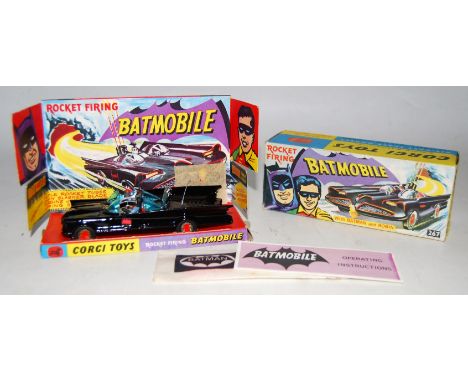 A Corgi Toys No. 267 Rocket Firing Batmobile comprising of gloss black body with Batman and Robin figures, bat logo stickers 