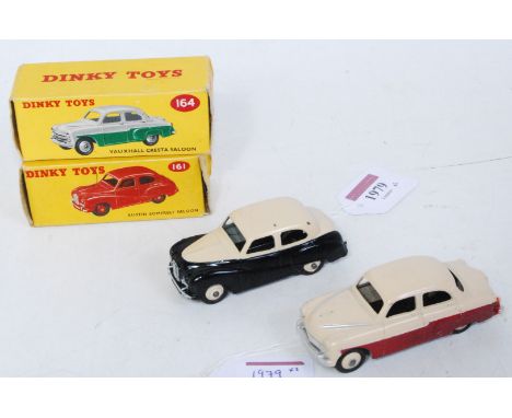 A Dinky Toys boxed saloon group to include No. 161 Austin Somerset saloon comprising of cream and black body with cream hubs,