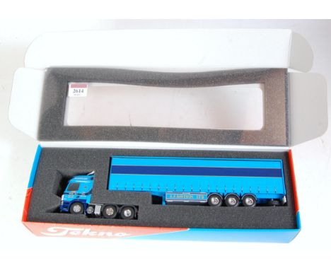 A Tekno 1/50 scale model of an AF Davison Ltd DAF CF curtainside tractor unit and trailer, appears as issued in the original 