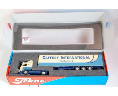 A Tekno 1/50 scale model of a Caffrey International Scania 143H tractor unit with refrigerated trailer, appears as issued in 