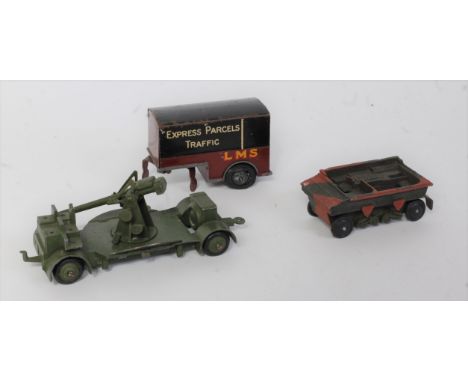 Three various loose Dinky Toys diecasts to include a No. 33RD LMS railway trailer, No. 161B anti-aircraft gun on trailer, and