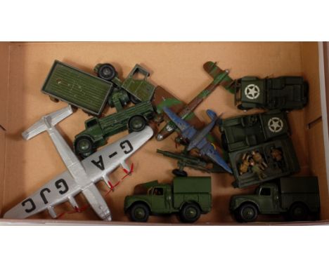 A collection of various pre- and post-war playworn Dinky Toy military diecasts, some examples have been overpainted to includ