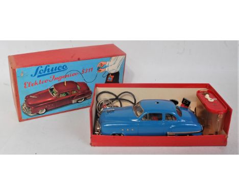 A Schuco No. 5311 Elektro Ingenico tinplate and battery operated saloon, comprising of blue body with detailed tinprinted int