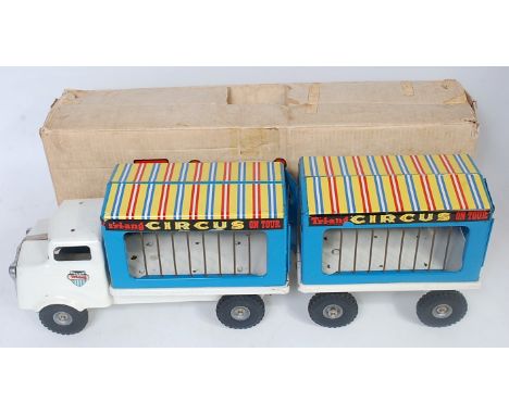 A Triang Toys tinplate and pressed steel model of a circus on tour truck and trailer, comprising white and blue body with cir