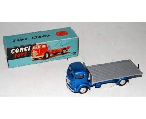 A Corgi Toys No. 454, five ton platform lorry comprising of metallic blue cab and chassis with silver back and spun hubs, in 