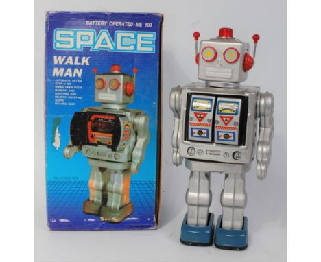 A Space Walk Man of China, silver tin plate and battery operated robot with tin printed details and blue feet, fitted with au