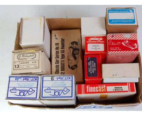 Twelve various boxed 1/43 scale resin and white metal classic car kits, manufacturers to include Minichamps, Mog Models, Robu