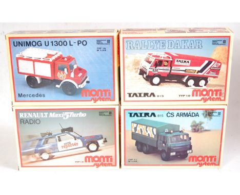 A Monti System of Czechoslovakia 1/48 scale plastic kit group to include a Rally Dakar 6-wheel racing lorry, Mercedes Unimog 