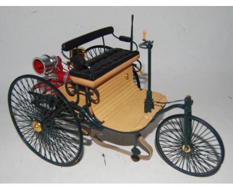 A Franklin Mint Precision Models 1/8 scale model of an 1886 Benz motor wagon, appears as issued in the original polystyrene a