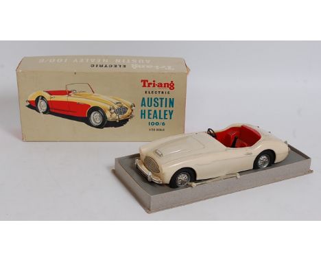 A Triang No. 100/6 1/20 scale model of an Austin Healey comprising of cream body with red interior and chrome hubs, model req